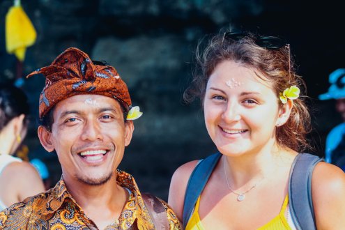 Girl with local Bali man smiling