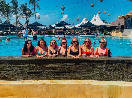 A group of girls in the pool at finns beach club in Bali Indonesia 