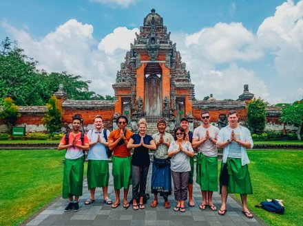 A group at the temple Taman Ayun in Bali Indonesia 