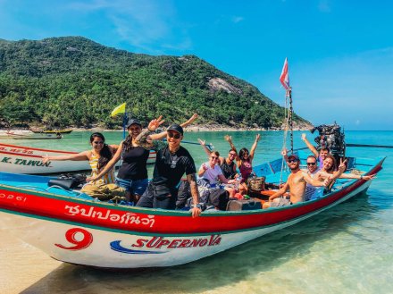 A group photo on a speed boat at bottle beach in Koh Phangan Thailand 
