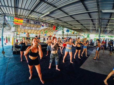 A group practicing muay Thai moves at a class in Koh Phangan Thailand