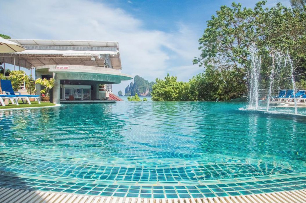 A shot of the gorgeous glistening blue swimming pool with fountains at the hotel in Koh Phi Phi, Thailand