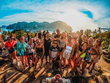 A group selfie at the viewpoint in Koh Phi Phi, Thailand just as the sun starts to set