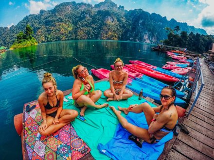 Four girls soaking up the sun at Khao Sok National park Thailand