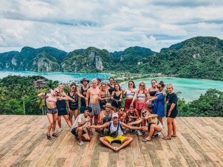 A group photo in front of Koh Phi Phi's stunning sea and land