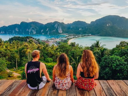 Three people admiring the beautiful landscape of Koh Phi Phi Thailand